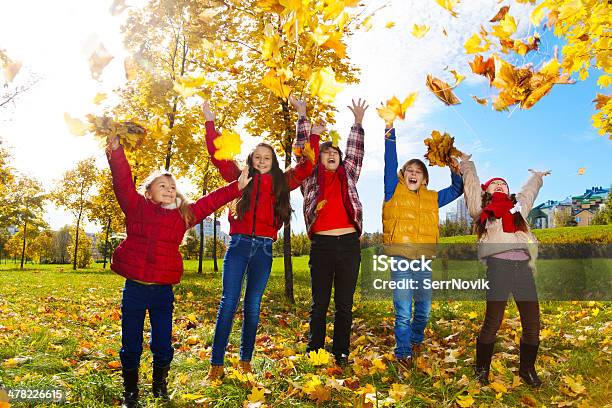 Kids Enjoying Autumn Maple Park Stock Photo - Download Image Now - Autumn, Boys, Casual Clothing