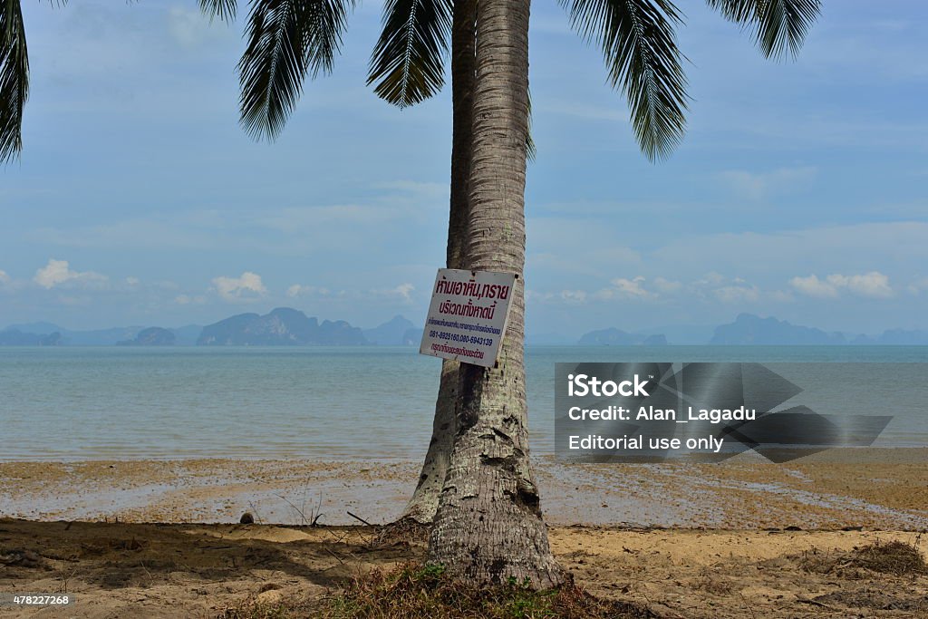 Koh Yao Noi, Thailand. Koh Yao Noi, Thailand - April 24, 2015: Land for sale at an idyllic tropical spot on Koh Yao Noi island at Un Pao beach with Western views of the Phang Nga national park islands. 2015 Stock Photo