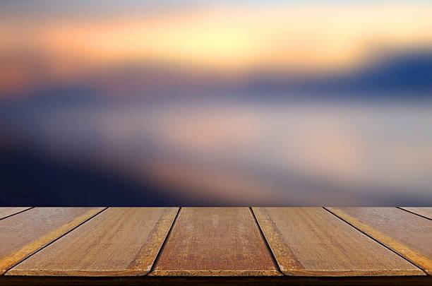 istock Blurred Sunrise Background with Wooden Table. 478230650