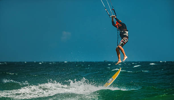istock Man Kitesurfing in blue sea 478231002