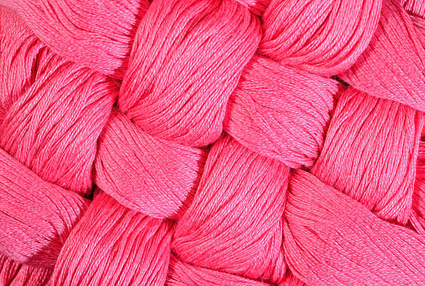 istock Pink twisted skeins of floss as background texture 478231110