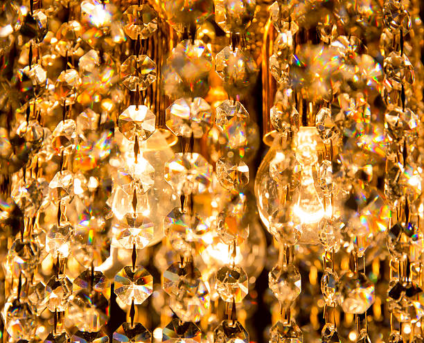 istock Crystal chandelier shines with golden light 478231226