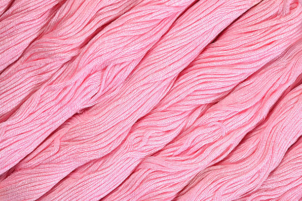 istock Pink skeins of floss as background texture 478234548