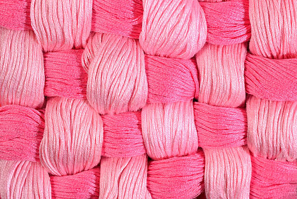 istock Pink twisted skeins of floss as background texture 478234554