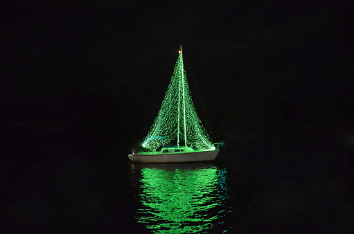 Yacht with illumination during Christmas parade.