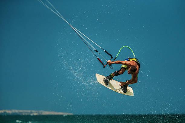 istock Man Kitesurfing in blue sea 478237666