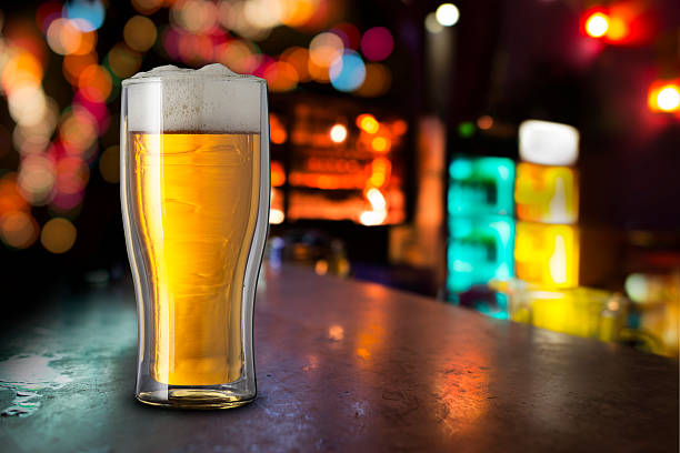 istock Glass of cold beer with bar scene 478238354