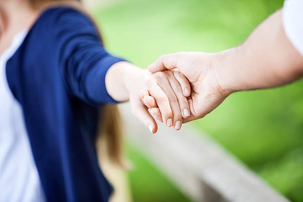 istock Couple Holding Hands In Park 478239366