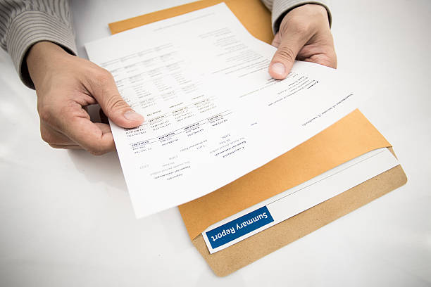 istock man hand with pen and business report 478241457