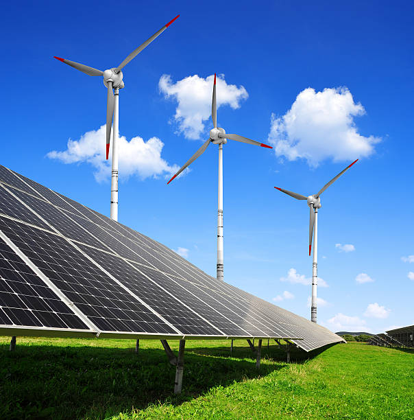 istock Solar energy panels and wind turbines 478241803