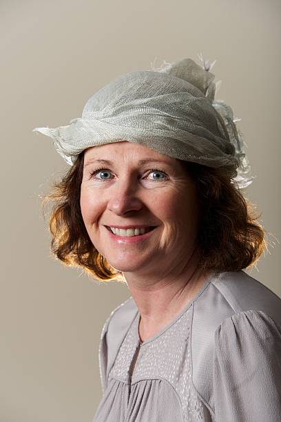 istock Brunette smiling in silver hat and blouse 478242991
