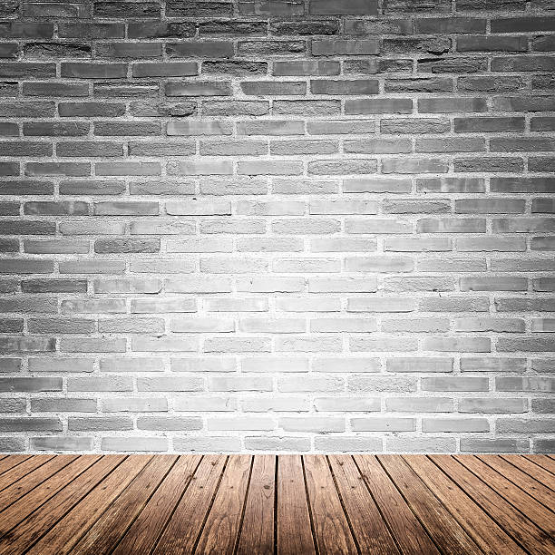 istock Old interior room with brick wall and wood floor 478243364