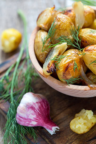 istock Baked potatoes, dill and garlic. 478244208