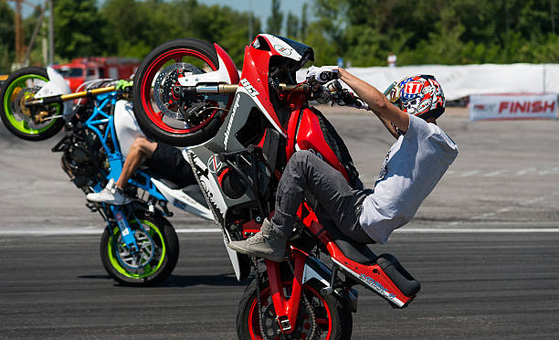 Unknown stunt bikers entertain the audience stock photo
