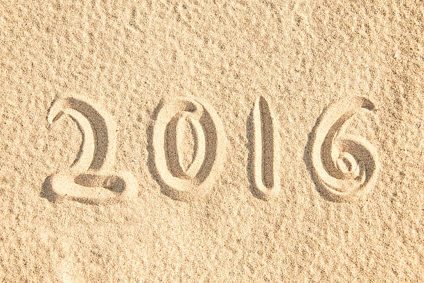 istock Close up on 2016 written in the sand 478247310