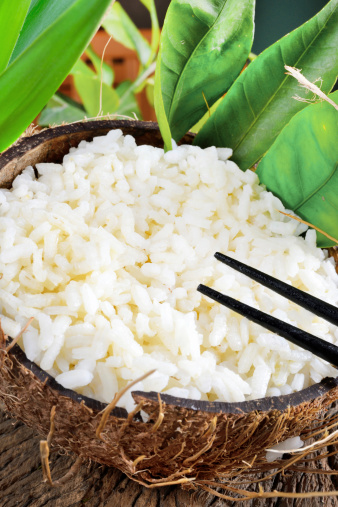 Chinese polished white boiled rice in coconut emptied