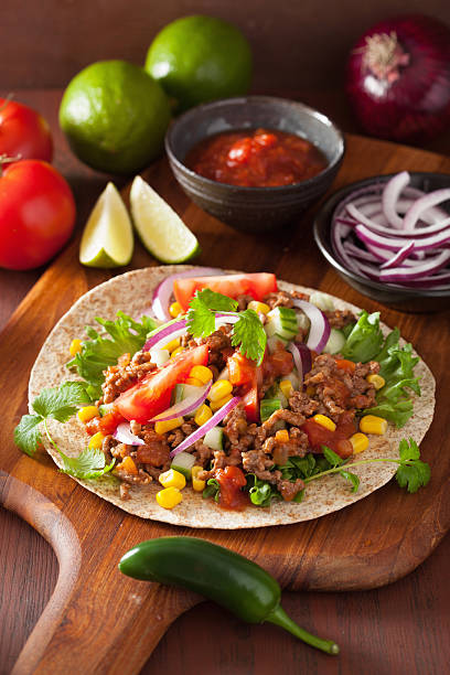 istock mexican taco with beef tomato salsa onion corn 478248492