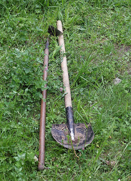 istock shovel and hoe on green grass 478248688