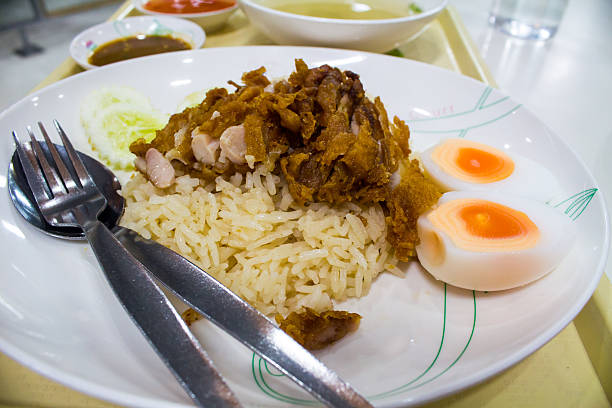 istock Rice steamed with chicken soup and boiled eggs food thailand. 478249099