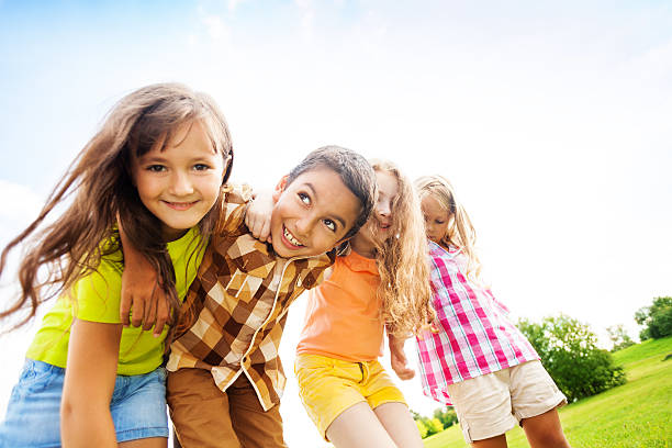 istock Happy kids hugging toggether 478249715
