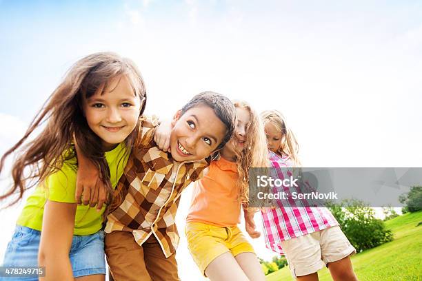 Happy Kids Hugging Toggether Stock Photo - Download Image Now - Child, Summer, Friendship