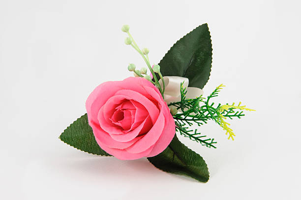 istock pink rose fake flower on white-gray 478249959