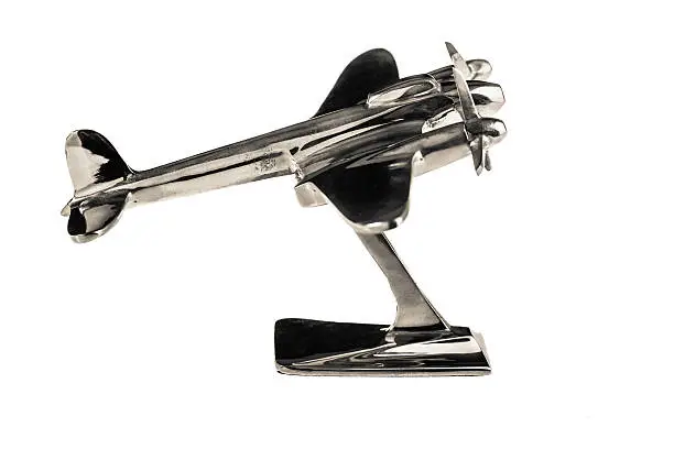 a shine chrome airplane model isolated over a white background