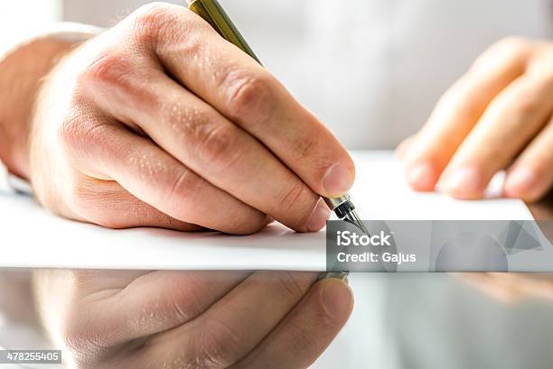 Man Writing On A Blank Paper Stock Photo - Download Image Now - Petition, Signing, Author