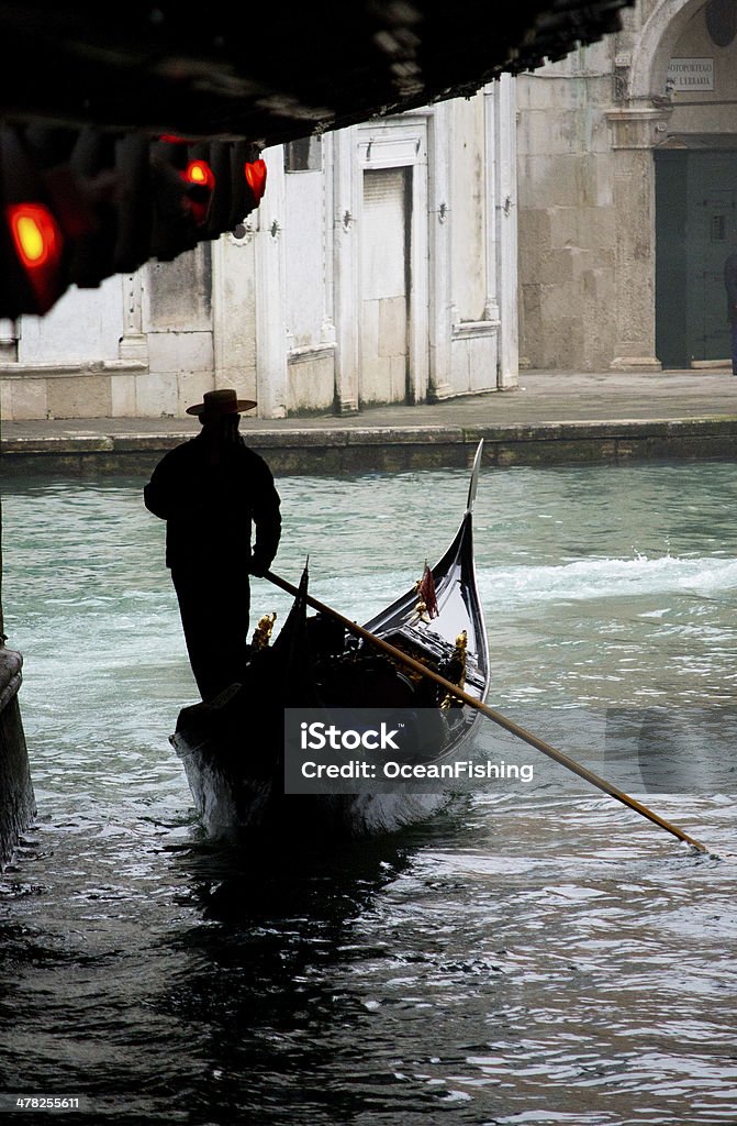 Gondola in Venice under old bridge Ancient Stock Photo