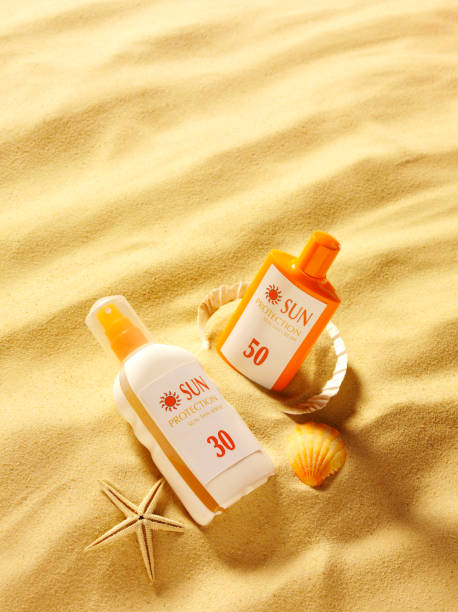 istock Sun Cream in the Sand with Seashells on a Beach 478256691