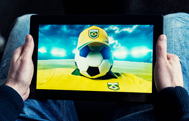 istock Watching Brazil soccer on a digital tablet 478256935