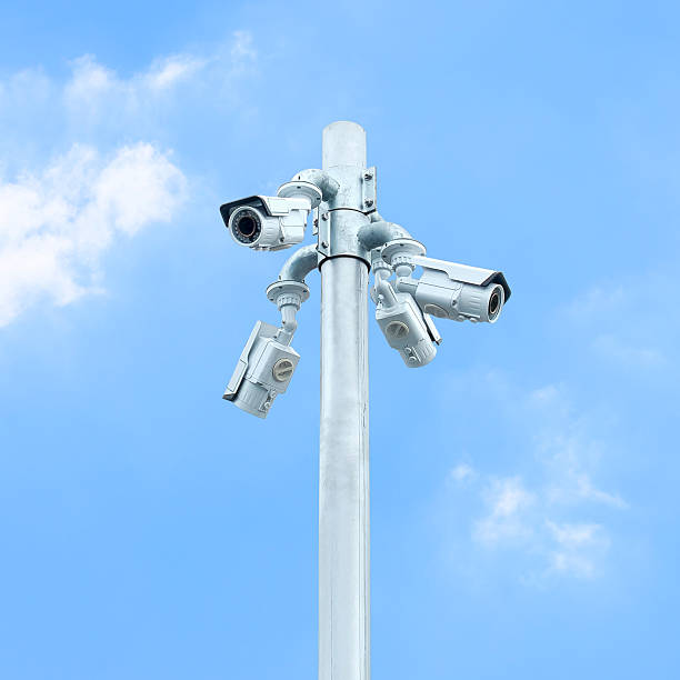 istock Group of CCTV on post with cloudy blue sky 478258262