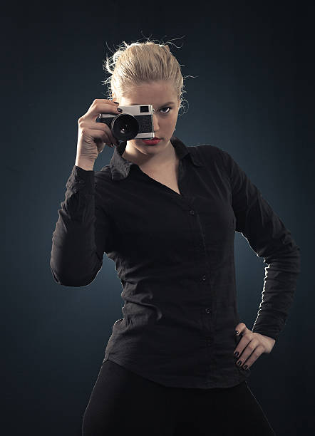 istock Young beautiful woman with classic vintage camera 478258343