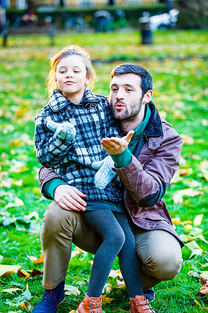 istock Father and daughter having fun in park 478260719