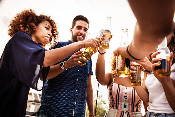 istock Friends having fun and drinking some beers outdoor 478262346