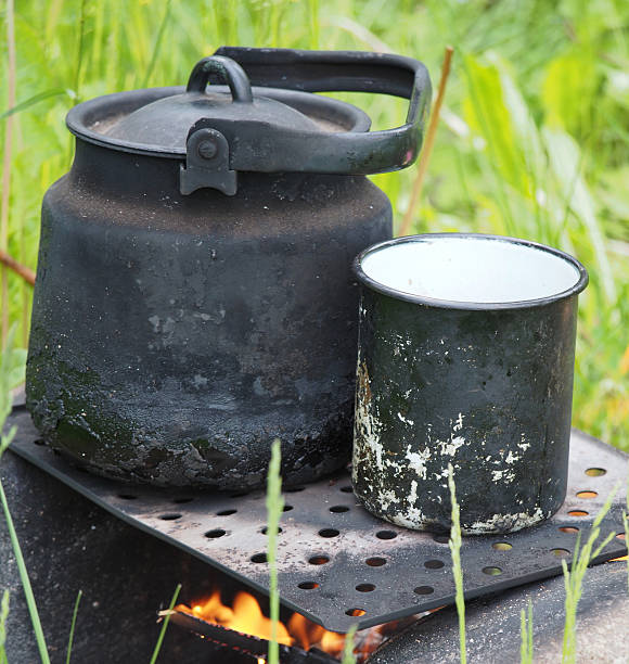 istock Teapot and kettle on a fire in the summer 478264545