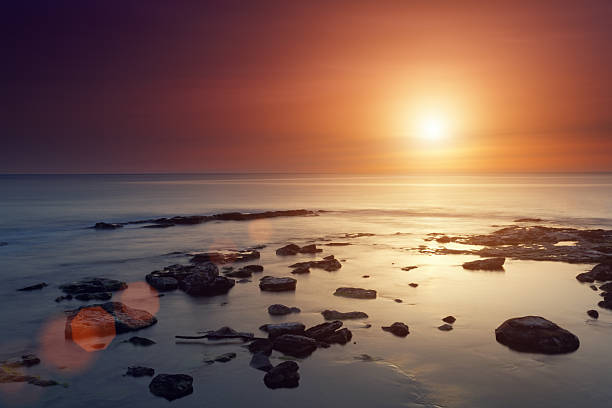 istock sunset at the sea 478266431
