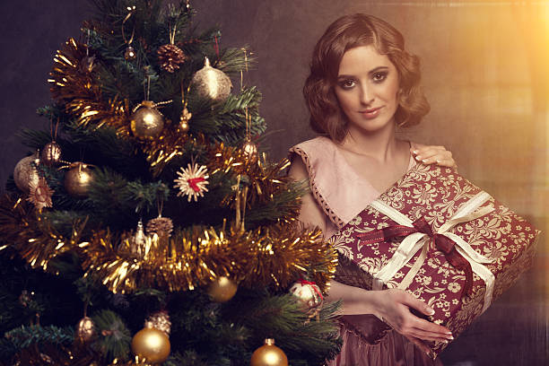 istock girl holding christmas gift 478266655