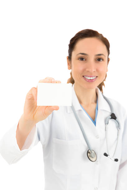 istock Female doctor showing sign card 478267330