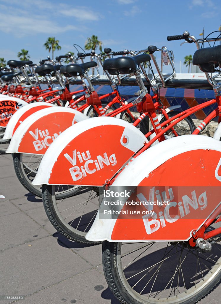 Bikes from a Bicycle share program in Barcelona Barcelona, Spain - June 17, 2015: Viu BiCing, a Bicycle share program in Barcelona gives residents and tourists one more transportation option and reduces the consumption of fossil fuels. 2015 Stock Photo