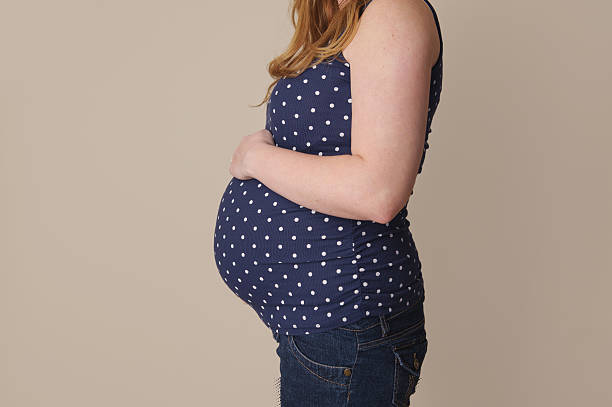 istock Pregnant Woman Holding Belly 478270153