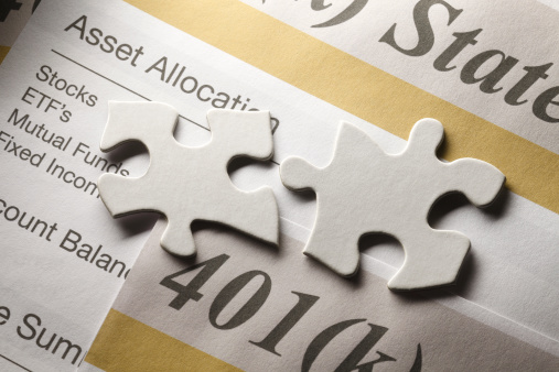 Two puzzle pieces on a 401k statement.