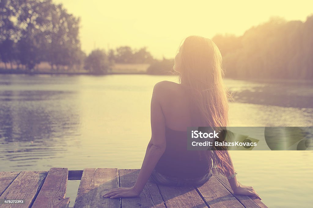 Vintage photo of relaxing young woman in nature Adult Stock Photo