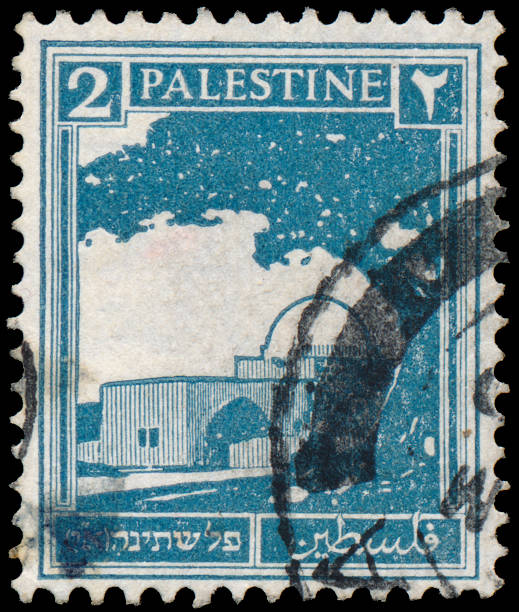 istock Stamp printed in Palestine shows building 478276373