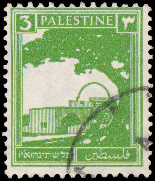 istock Stamp printed in Palestine shows building 478276377
