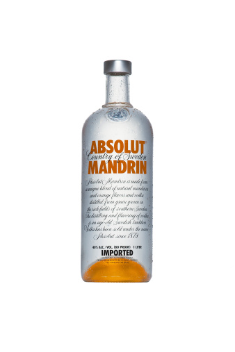 Barcelona, Spain - December 5, 2012: Studioshot of a bottle of Absolut Vodka Mandrin on white background.