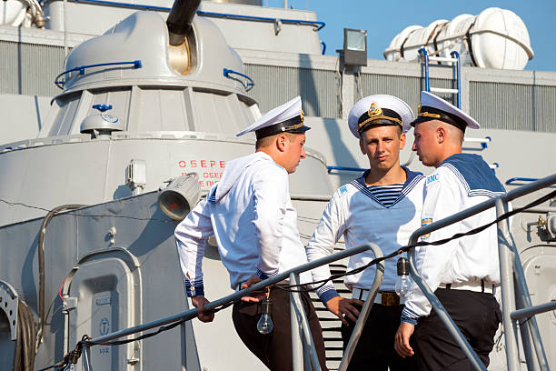 Sevastopol, Crimea, Ukraine - July 28, 2013: Ukrainian sailors stand on their ship, the U155 Prydniprovia, docked in the Black Sea port of Sevastopol, in southern Ukraine. Located in Ukraine's Crimean Peninsula, Sevastopol is home to both Russian and Ukrainian navies.