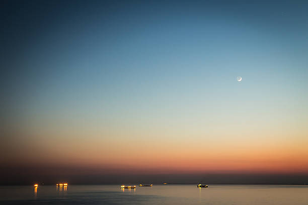 istock moon over the boats 478278318