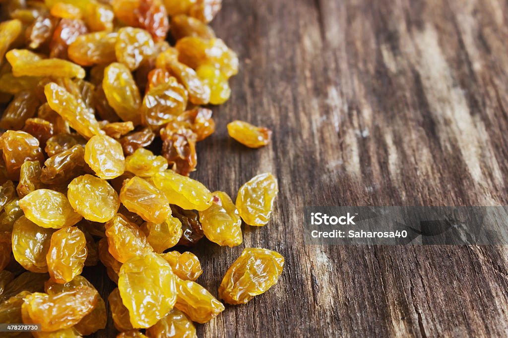 grape appetizing raisin on the old wooden background. close-up. health and diet food. selective focus. copy space for you text 2015 Stock Photo