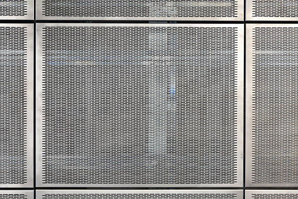 Metal grid tiles on the wall. stock photo